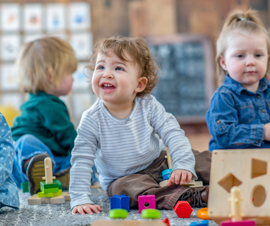 Toddler playing indoors, engaging in fun activities to stay busy